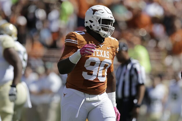 Texas' Malcom Brown (90) lines up against Baylor during the second half of an NCAA college football game, Saturday, Oct. 4, 2014, in Austin, Texas. (AP Photo/Eric Gay)