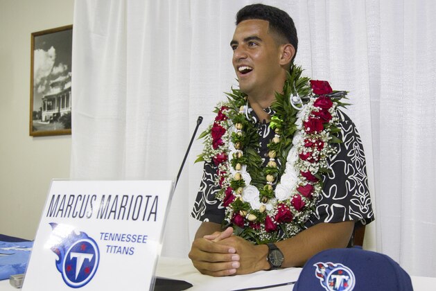Former Oregon quarterback Marcus Mariota meets with the media after being selected in the first round with the second pick by the Tennessee Titans on NFL Draft Day Thursday, April 30, 2015, in Honolulu. Mariota along with his family and friends gathered at the Saint Louis Alumni Clubhouse to celebrate his selection in the NFL Draft. (AP Photo/Eugene Tanner)