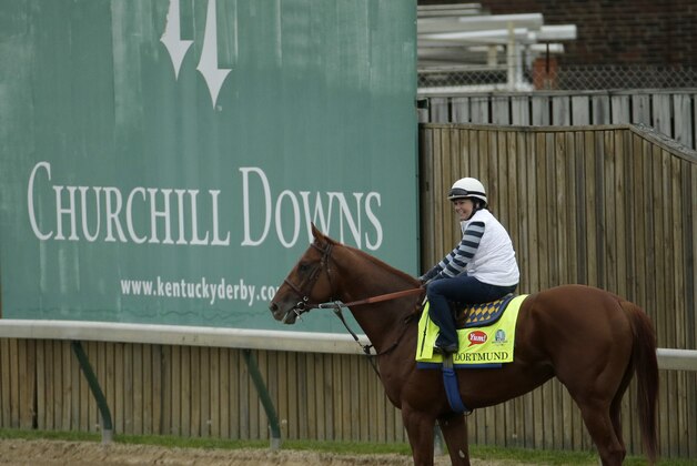 Kentucky Derby entrant Dortmund is ridden by exercise rider Dana Barnes during a morning workout at Churchill Downs Thursday, April 30, 2015, in Louisville, Ky. (AP Photo/Charlie Riedel)
