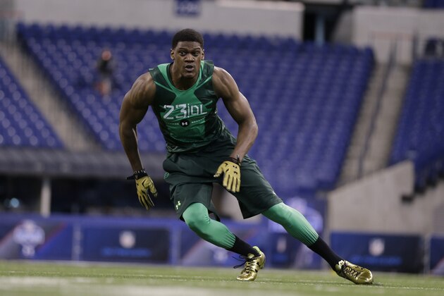 Nebraska defensive lineman Randy Gregory runs a drill at the NFL football scouting combine in Indianapolis, Sunday, Feb. 22, 2015. (AP Photo/David J. Phillip)