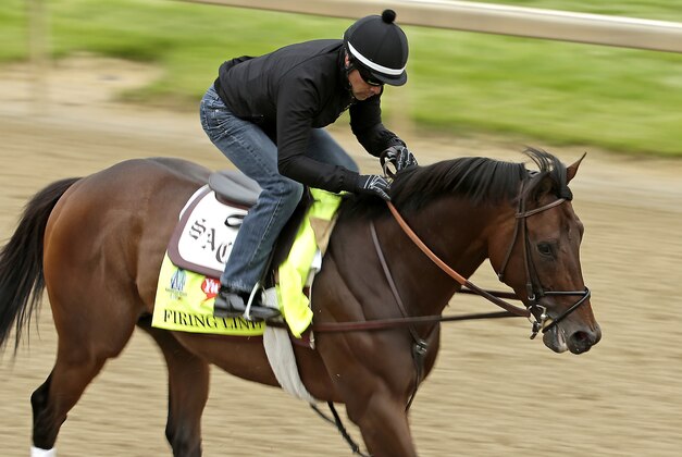 Exercise rider Humberto Gomez rides Kentucky Derby entrant Firing Line during a morning workout at Churchill Downs Thursday, April 30, 2015, in Louisville, Ky. (AP Photo/Charlie Riedel)
