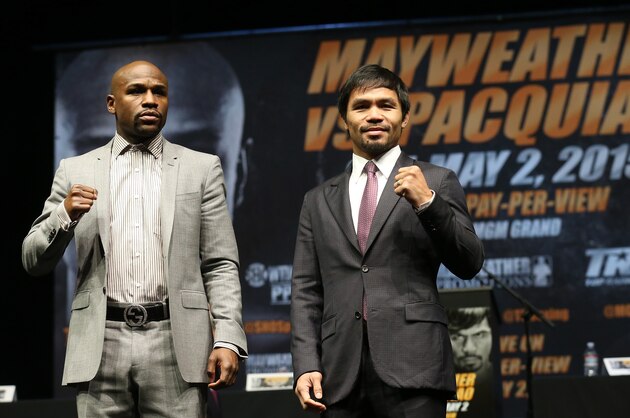 LOS ANGELES, CA - MARCH 11:  Floyd Mayweather (L) and Manny Pacquiao pose together at the end of their Press Conference promoting their upcoming fight on March 11, 2015 in Los Angeles, California.  (Photo by Stephen Dunn/Getty Images)