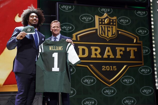 USC defensive lineman Leonard Williams poses for photos with NFL commissioner Roger Goodell after being selected by the New York Jets as the sixth pick in the first round of the 2015 NFL Draft,  Thursday, April 30, 2015, in Chicago. (AP Photo/Charles Rex Arbogast)