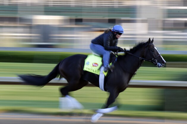 Exercise rider Vicki King takes Kentucky Derby entrant Upstart for a morning workout for the 141th running of the Kentucky Derby horse race at Churchill Downs Friday, May 1, 2015, in Louisville, Ky. (AP Photo/Charlie Riedel)