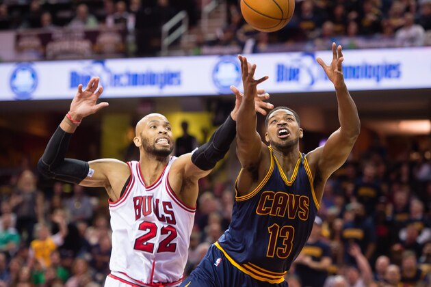 CLEVELAND, OH - APRIL 5: Taj Gibson #22 of the Chicago Bulls and Tristan Thompson #13 of the Cleveland Cavaliers fight for a rebound during the second half at Quicken Loans Arena on April 5, 2015 in Cleveland, Ohio. The Cavaliers defeated the Bulls 99-94. NOTE TO USER: User expressly acknowledges and agrees that, by downloading and or using this photograph, User is consenting to the terms and conditions of the Getty Images License Agreement. (Photo by Jason Miller/Getty Images)