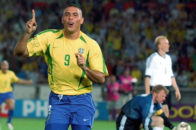 FILE - In this June 30, 2002,  file photo, Brazil's Ronaldo reacts after scoring past Germany's goalkeeper Oliver Kahn, center, and Carsten Ramelow during their 2002 World Cup final soccer match, at the Yokohama stadium in Yokohama, Japan. On this day: Brazil wins its fifth World Cup as Ronaldo strikes twice to defeat Germany 2-0. (AP Photo/Dusan Vranic, File)