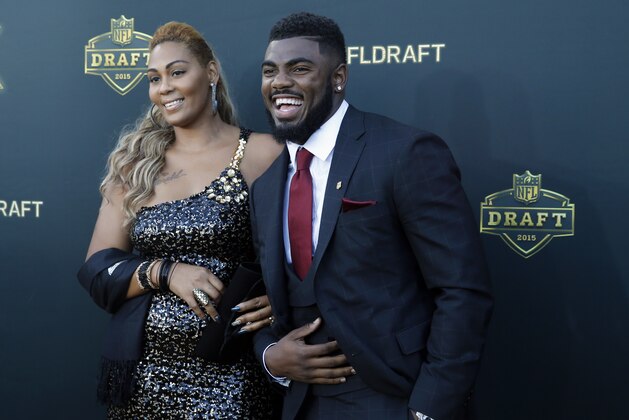 Alabama defensive back Landon Collins poses for photos his mother April Justin, upon arriving for the first round of the 2015 NFL Football Draft at the Auditorium Theater of Roosevelt University, Thursday, April 30, 2015, in Chicago. (AP Photo/Charles Rex Arbogast)