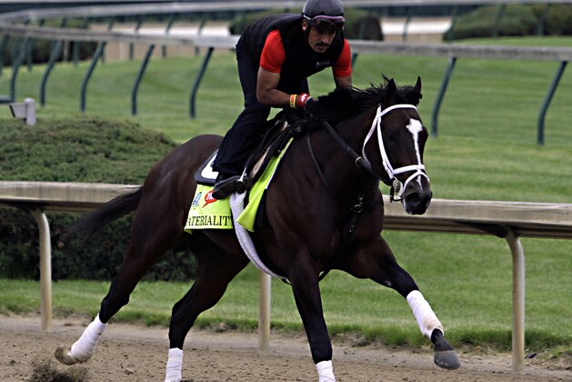 Kentucky Derby entrant Materiality, ridden by exercise rider Carlos Cano, gallops at Churchill Downs in Louisville, Ky., Thursday, April 30, 2015.  (AP Photo/Garry Jones)