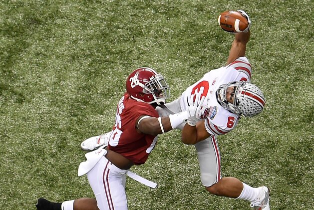 NEW ORLEANS, LA - JANUARY 01:  Evan Spencer #6 of the Ohio State Buckeyes in action against Landon Collins #26 of the Alabama Crimson Tide during the All State Sugar Bowl at the Mercedes-Benz Superdome on January 1, 2015 in New Orleans, Louisiana.  (Photo by Stacy Revere/Getty Images)