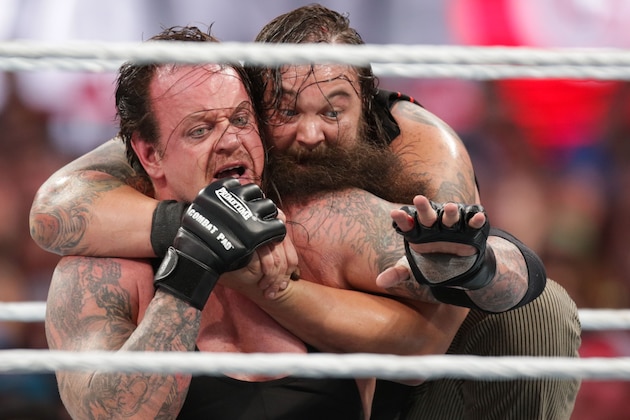 Bray Wyatt keeps his opponent The Undertaker in a hold at Wrestlemania XXXI, on Sunday, March 29, 2015 in Santa Clara, CA. 2015 marks the first year Wrestlemania will be held in the San Francisco Bay Area, being made available to viewers in 177 countries via the WWE Network. (Don Feria/AP Images for WWE)