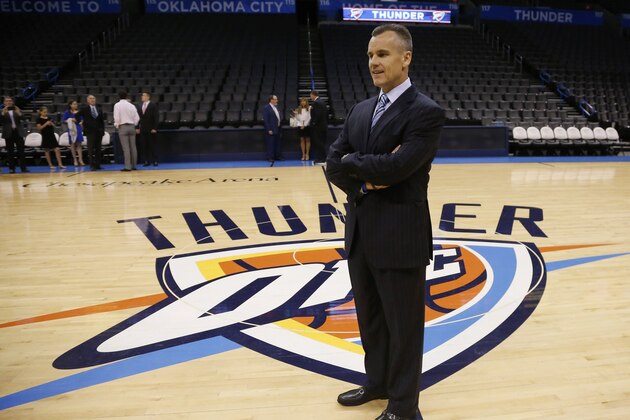Billy Donovan, newly named head coach of the NBA Oklahoma City Thunder, poses for a photo on the Thunder logo prior to a news conference in Oklahoma City, Friday, May 1, 2015. (AP Photo/Sue Ogrocki)