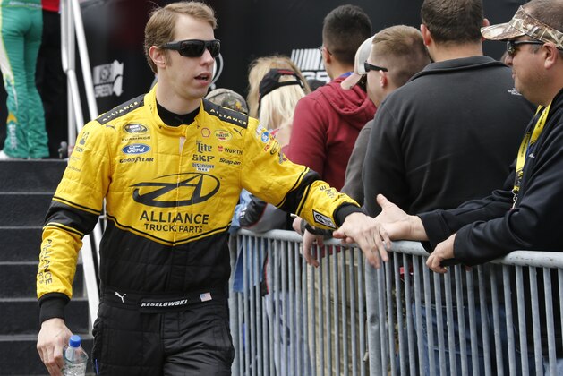 Sprint Cup driver Brad Keselowski greets fans during driver introductions prior to the start of the NASCAR Sprint Cup auto race at Richmond International Raceway in Richmond, Va., Sunday, April 26, 2015.   (AP Photo/Steve Helber)