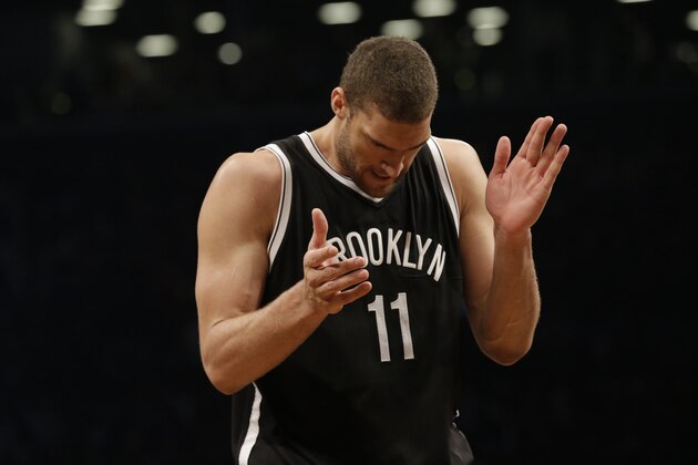 Brooklyn Nets center Brook Lopez reacts to a play during the first half in Game 3 of a first-round NBA basketball playoff series, Saturday against the Atlanta Hawks, April 25, 2015, at  New York.  The Nets won 91-83. (AP Photo/Mary Altaffer)