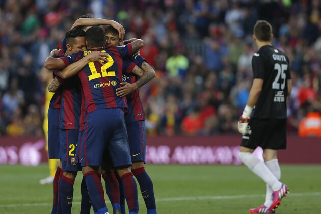 Barcelona's Neymar, from Brazil, center right, celebrates scoring his side's 3rd goal with teammates during a Spanish La Liga soccer match between F.C. Barcelona and Getafe at the Camp Nou stadium in Barcelona, Spain, Tuesday, April 28, 2015. (AP Photo/Emilio Morenatti)