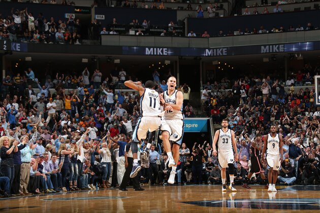 MEMPHIS, TN - APRIL 9: Mike Conley #11 and Nick Calathes #12 of the Memphis Grizzlies celebrate during a game against the Miami Heat on April 9, 2014 at FedExForum in Memphis, Tennessee. NOTE TO USER: User expressly acknowledges and agrees that, by downloading and or using this photograph, User is consenting to the terms and conditions of the Getty Images License Agreement. Mandatory Copyright Notice: Copyright 2014 NBAE (Photo by Joe Murphy/NBAE via Getty Images)