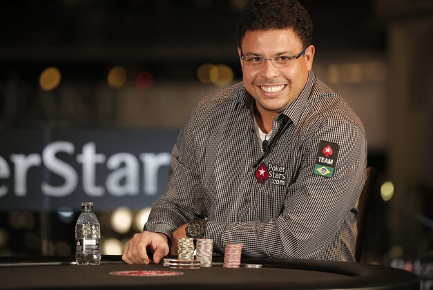 Brazilian former soccer player Ronaldo plays a poker match for charity against tennis player Rafael Nadal, of Spain, at a casino in central London, Tuesday, Nov. 18, 2014. According to the organisers, an online poker company, the athletes for the past two months have been in training, after Ronaldo challenged Nadal to the live head-to-head poker match after the two first went head-to-head in December at the European Poker Tour Prague Charity Challenge. Nadal won the match to receive a $ 50,000 donation for the Rafael Nadal Foundation. (AP Photo/Lefteris Pitarakis)