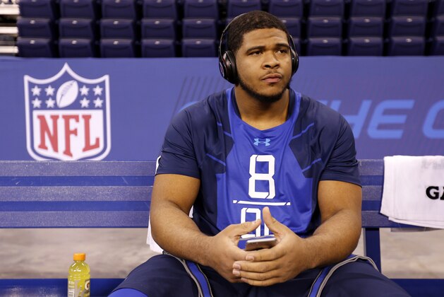 LSU offensive lineman La'El Collins sits on a bench at the NFL football scouting combine in Indianapolis, Friday, Feb. 20, 2015. (AP Photo/Julio Cortez)