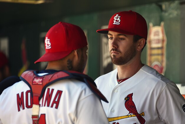 Apr 30, 2015; St. Louis, MO, USA; St. Louis Cardinals starting pitcher Tim Cooney (66) and catcher Yadier Molina (4) talk before the game against the Philadelphia Phillies at Busch Stadium. Mandatory Credit: Jasen Vinlove-USA TODAY Sports