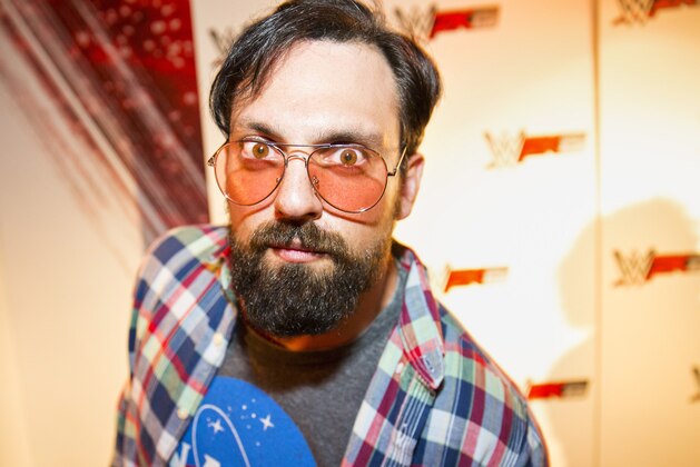 IMAGE DISTRIBUTED FOR 2K - WWE Superstar Damien Sandow, dressed as a stereotypical gamer, at the WWE 2K15 Press Event at Cicada Restaurant, on Saturday, August 16, 2014 in Los Angeles. (Photo by Colin Young-Wolff/Invision for 2K/AP Images)