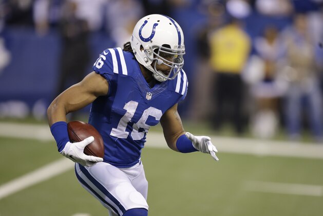 Indianapolis Colts wide receiver Josh Cribbs runs after a catch against the Houston Texans during the first half of an NFL football game in Indianapolis, Sunday, Dec. 14, 2014. (AP Photo/Darron Cummings)