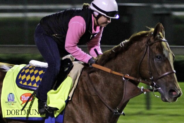 Exercise rider Dana Barnes gallops Kentucky Derby entrant Dortmund at Churchill Downs in Louisville, Ky., Friday, May 1, 2015.  (AP Photo/Garry Jones)