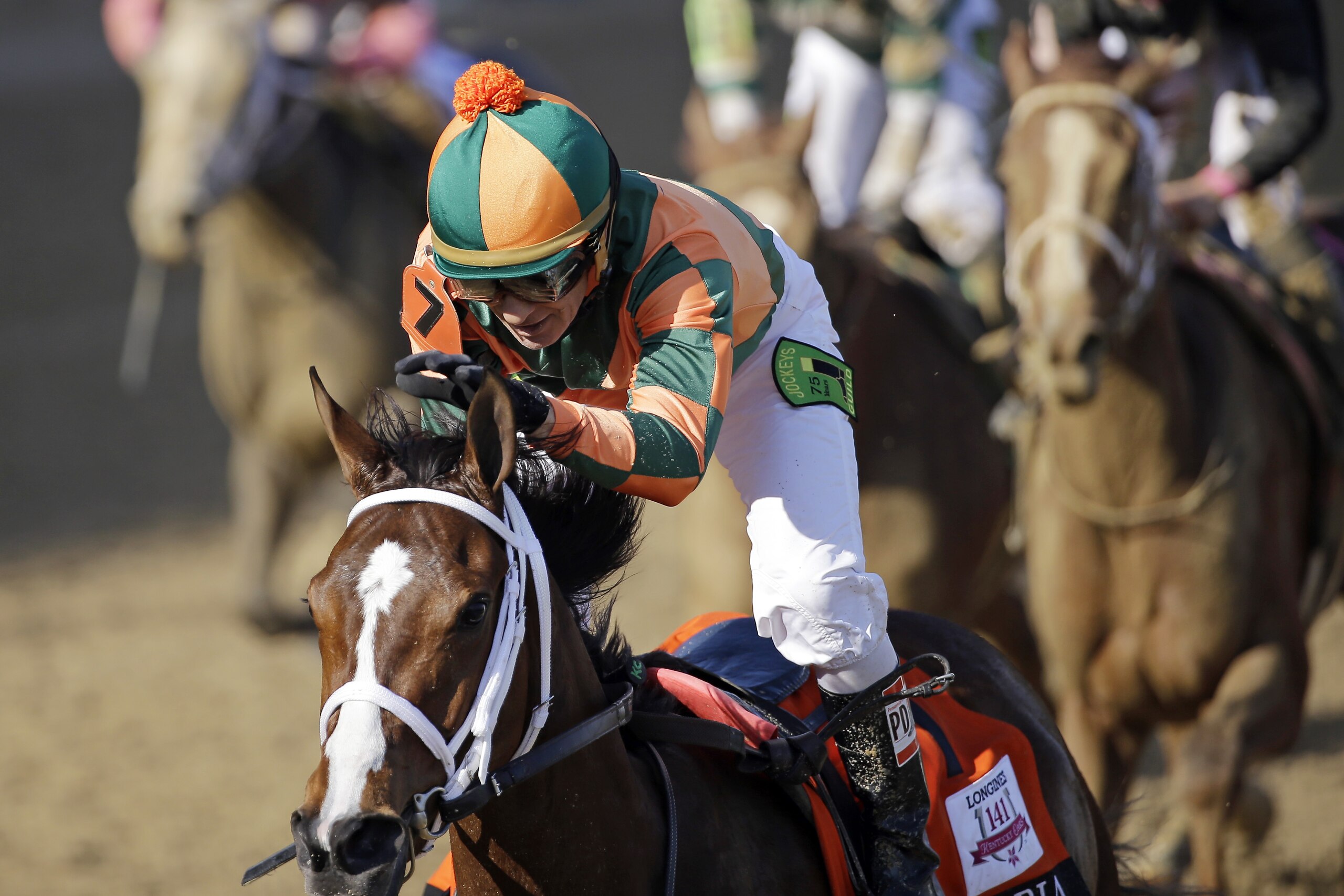 Kerwin D. Clark rides Lovely Maria to victory during the 141st running of the Kentucky Oaks horse race at Churchill Downs Friday, May 1, 2015, in Louisville, Ky. (AP Photo/David J. Phillip)