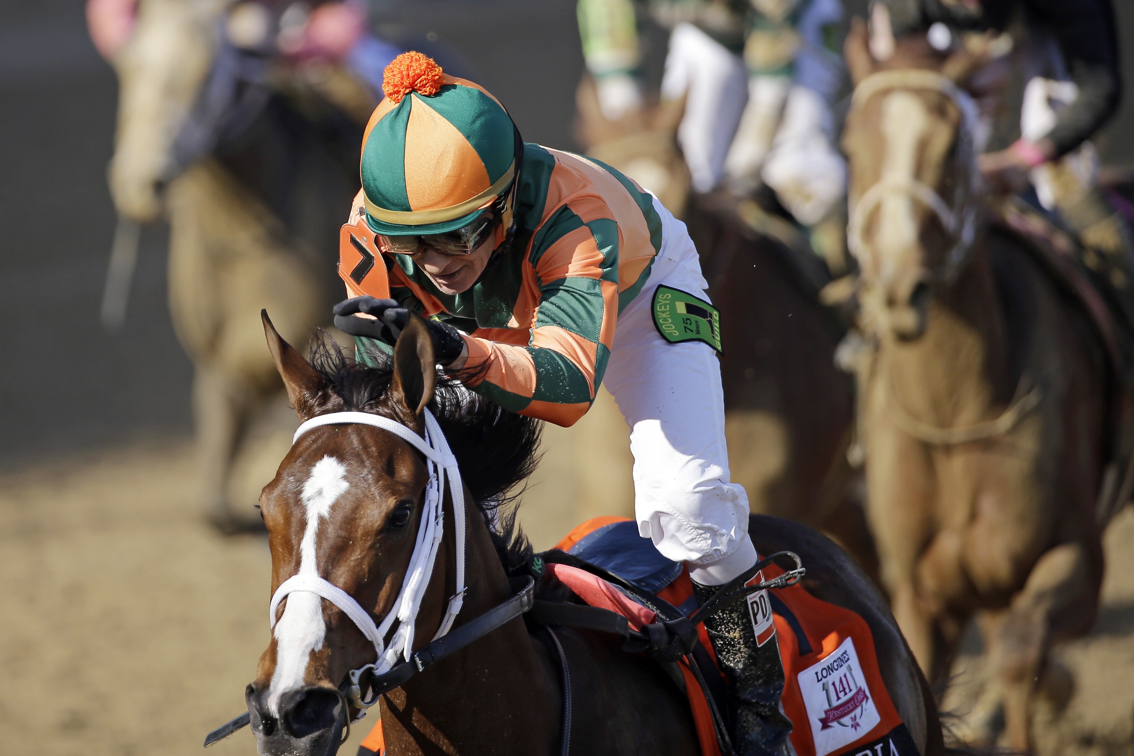 Kerwin D. Clark rides Lovely Maria to victory during the 141st running of the Kentucky Oaks horse race at Churchill Downs Friday, May 1, 2015, in Louisville, Ky. (AP Photo/David J. Phillip)