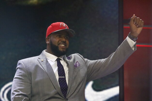 Penn State offensive lineman Donovan Smith celebrates after being selected by the Tampa Bay Buccaneers as the 34th pick in the second round of the 2015 NFL Football Draft,  Friday, May 1, 2015, in Chicago. (AP Photo/Charles Rex Arbogast)