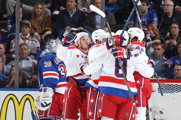 NEW YORK, NY - APRIL 30:  Alex Ovechkin #8, Joel Ward #42, Brooks Orpik #44 and John Carlson #74 of the Washington Capitals celebrate after scoring in the final seconds of the third period to defeat the New York Rangers 2-1 in Game One of the Eastern Conference Semifinals during the 2015 NHL Stanley Cup Playoffs at Madison Square Garden on April 30, 2015 in New York City. (Photo by Jared Silber/NHLI via Getty Images)
