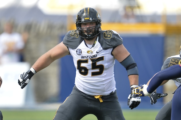 Missouri Tigers offensive linesman Mitch Morse (65) lines up in the first quarter of a 49-24 win over the Toledo Rockets in an NCAA college football game in Toledo, Ohio, Saturday, Sept. 6, 2014. (AP Photo/David Richard)