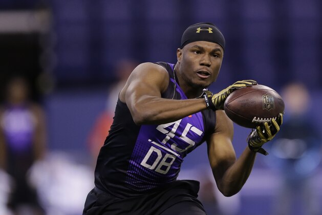 Florida Atlantic defensive back D'Joun Smith runs a drill at the NFL football scouting combine in Indianapolis, Monday, Feb. 23, 2015. (AP Photo/Julio Cortez)
