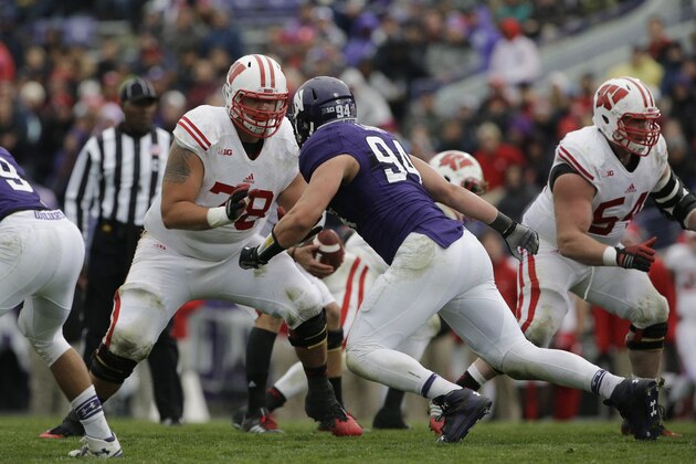Wisconsin offensive line Rob Havenstein (78), left,  plays against Northwestern defensive line Dean Lowry (94) during the second half of an NCAA college football game in Evanston, Ill., Saturday, Oct. 4, 2014. Northwestern won 20-14. (AP Photo/Nam Y. Huh)