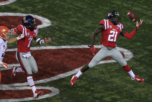 Aug 28, 2014; Atlanta, GA, USA; Mississippi Rebels defensive back Senquez Golson (21) intercepts the ball in the end zone thrown by Boise State Broncos quarterback Grant Hedrick (not pictured) in the first quarter of the 2014 Chick-fil-a Kickoff Game at the Georgia Dome. Mandatory Credit: Paul Abell-USA TODAY Sports