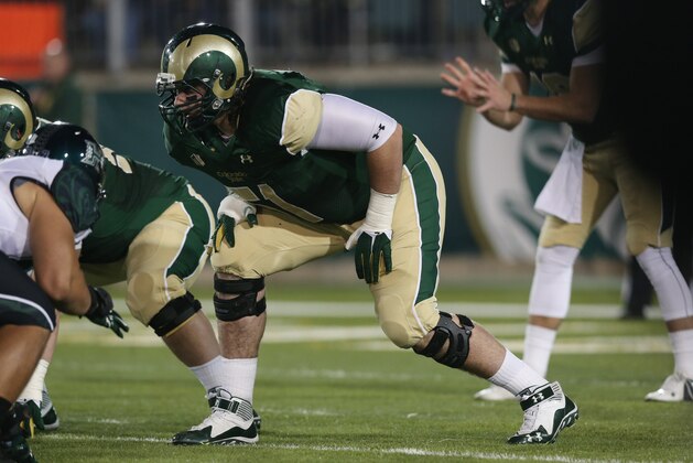 Colorado State offensive lineman Ty Sambrailo sets for play against Hawaii in the third quarter of Colorado State's 49-22 victory in an NCAA college football game in Fort Collins, Colo., on Saturday, Nov. 8, 2014. (AP Photo/David Zalubowski)