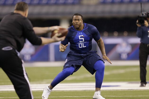 South Carolina offensive lineman A.J. Cann runs a drill at the NFL football scouting combine in Indianapolis, Friday, Feb. 20, 2015. (AP Photo/David J. Phillip)