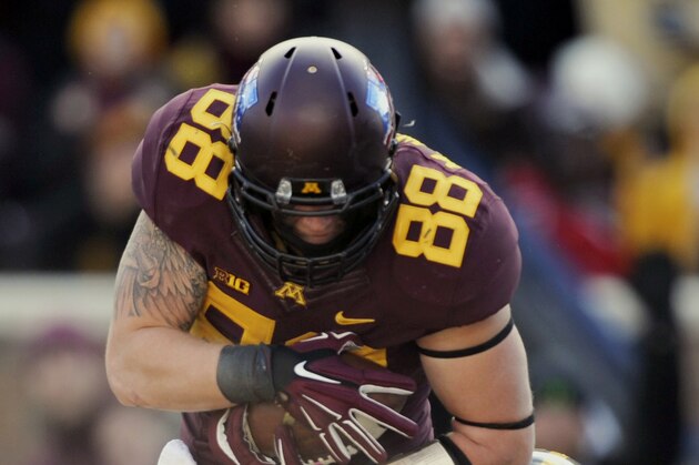 Minnesota tight end Maxx Williams (88) makes a catch for a touchdown against Iowa defensive back Desmond King (14) during the first half of an NCAA college football game on Saturday, Nov. 8, 2014, in Minneapolis. (AP Photo/Hannah Foslien)