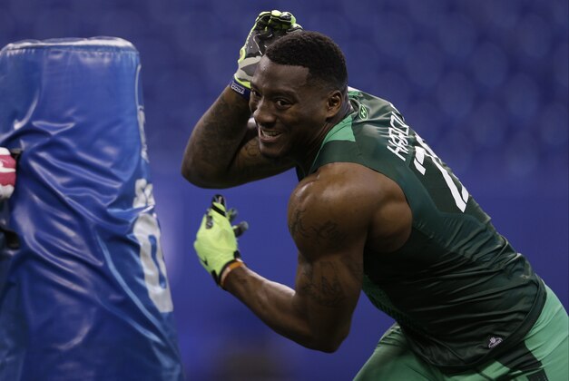 Virginia defensive lineman Eli Harold runs a drill at the NFL football scouting combine in Indianapolis, Sunday, Feb. 22, 2015. (AP Photo/David J. Phillip)