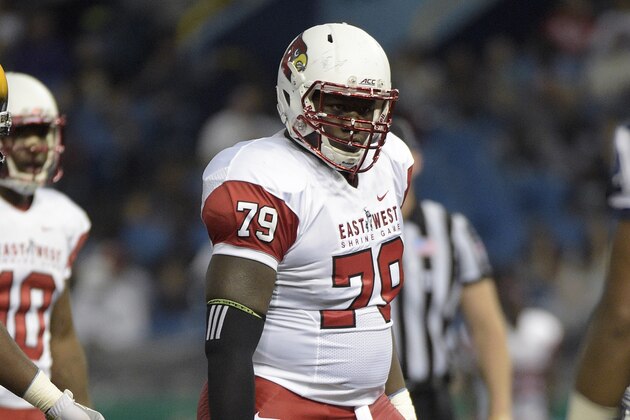 East offensive lineman Jamon Brown (79), of Louisville, sets up for a play during the first half of the East-West Shrine college football game against the West in St. Petersburg, Fla., Saturday, Jan. 17, 2015.(AP Photo/Phelan M. Ebenhack)