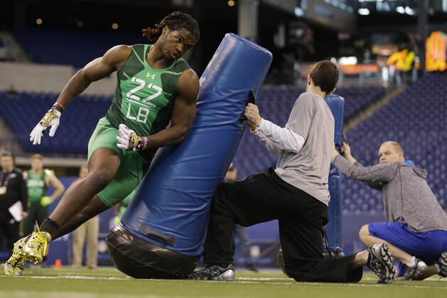 Louisville linebacker Lorenzo Mauldin runs a drill at the NFL football scouting combine in Indianapolis, Sunday, Feb. 22, 2015. (AP Photo/David J. Phillip)