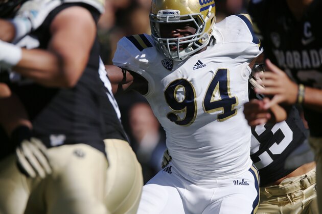 UCLA defensive lineman Owamagbe Odighizuwa rushes Colorado UCLA in the second quarter of an NCAA football game in Boulder, Colo., on Saturday, Oct. 25, 2014. (AP Photo/David Zalubowski)