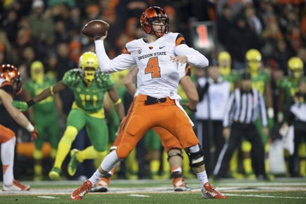 CORRECTS DATE TO NOV. 29, 2014 - Oregon State quarterback Sean Mannion (4) passes against Oregon during the second quarter of an NCAA college football game in Corvallis, Or., Saturday, Nov. 29, 2014. (AP Photo/Troy Wayrynen)