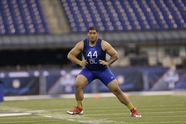 Utah offensive lineman Jeremiah Poutasi runs a drill at the NFL football scouting combine in Indianapolis, Friday, Feb. 20, 2015. (AP Photo/David J. Phillip)
