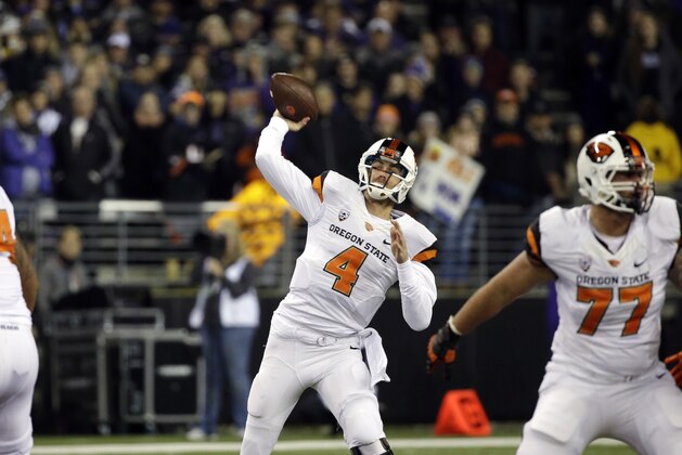 Oregon State quarterback Sean Mannion in action against Washington in the second half of an NCAA college football game Saturday, Nov. 22, 2014, in Seattle. Washington won 37-13. (AP Photo/Elaine Thompson)
