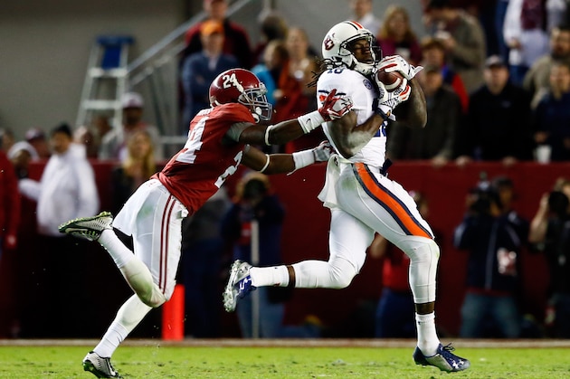 TUSCALOOSA, AL - NOVEMBER 29:  Sammie Coates #18 of the Auburn Tigers catches a 53 yard pass thrown by Nick Marshall #14 in the fourth quarter against Geno Smith #24 of the Alabama Crimson Tide during the Iron Bowl at Bryant-Denny Stadium on November 29, 2014 in Tuscaloosa, Alabama.  (Photo by Kevin C. Cox/Getty Images)