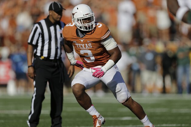 Texas' Jordan Hicks defends against Baylor during the second half of an NCAA college football game, Saturday, Oct. 4, 2014, in Austin, Texas. (AP Photo/Eric Gay)