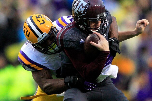 BATON ROUGE, LA - NOVEMBER 23:  Quarterback Johnny Manziel #2 of the Texas A&M Aggies is sacked by defensive end Danielle Hunter #94 of the LSU Tigers at Tiger Stadium on November 23, 2013 in Baton Rouge, Louisiana.  (Photo by Sean Gardner/Getty Images)