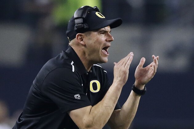 Oregon head coach Mark Helfrich during the first half of the NCAA college football playoff championship game against Ohio State Monday, Jan. 12, 2015, in Arlington, Texas. (AP Photo/Brandon Wade)
