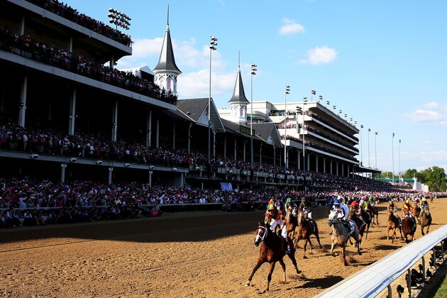 LOUISVILLE, KY - MAY 01:  Lovely Maria #7, ridden by Kerwin D. Clark, leads the field to the finish line to win the 141st running of the Kentucky Oaks at Churchill Downs at Churchill Downs on May 1, 2015 in Louisville, Kentucky.  (Photo by Rob Carr/Getty Images)