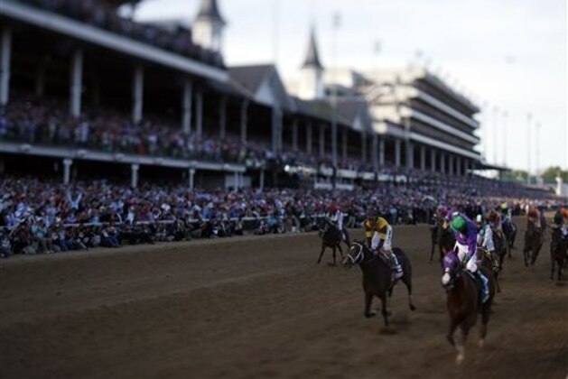 Victor Espinoza rides California Chrome to a victory during the 140th running of the Kentucky Derby horse race at Churchill Downs Saturday, May 3, 2014, in Louisville, Ky. (AP Photo/Matt Slocum)