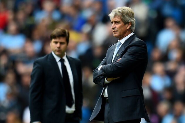 MANCHESTER, ENGLAND - OCTOBER 18:  Manuel Pellegrini the manager of Manchester City and Mauricio Pochettino the manager of Spurs look on during the Barclays Premier League match between Manchester City and Tottenham Hotspur at Etihad Stadium on October 18, 2014 in Manchester, England.  (Photo by Shaun Botterill/Getty Images)